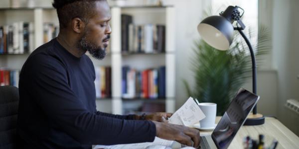 Person calculating budget and doing his finances.