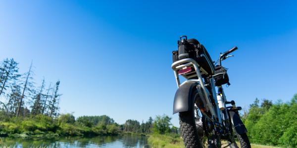 Fat tire eBike on a grass covered trail.