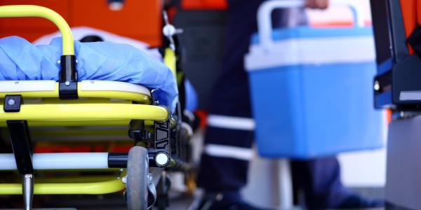 Human organ being transported in a cooler in an ambulance.